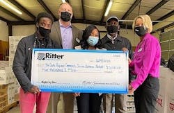 Representatives from The Delta Regional Community Services Outreach Network accept a $5,000 donation from Ritter Communications Director of Sales Josh Bradley (second from left) and sales representative Michele Watson (far right).